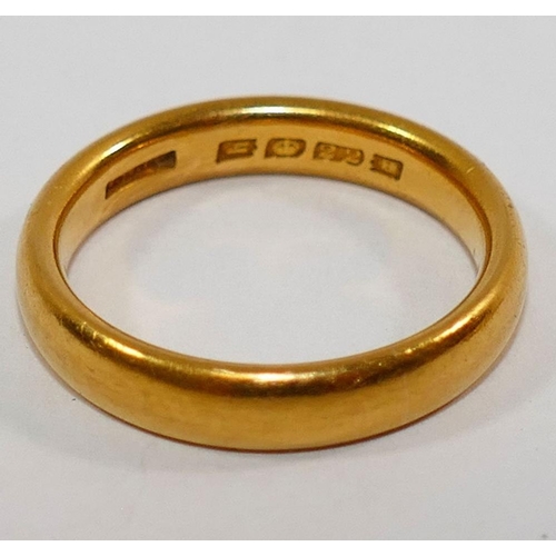 195 - A heavy 22 carat gold wedding band, London 1923, 4mm wide, finger size P 1/2, 7.9g, and another 22 c... 