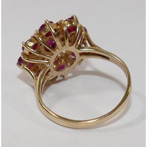 208 - A 9 carat gold ruby and diamond circular cluster ring, the circular and oval mixed cut rubies in cla... 