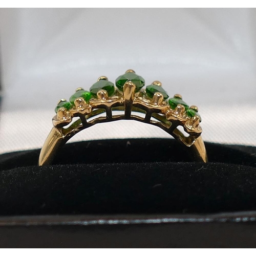 233 - A 9 carat gold seven stone chromium diopside ring, Birmingham 2009, the graduated marquise-shaped gr... 