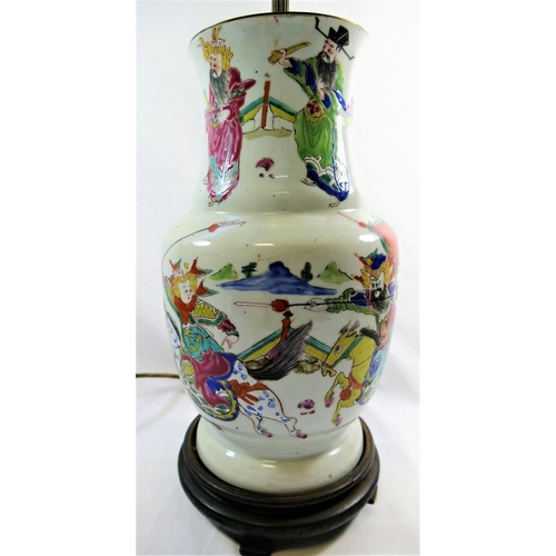 45 - A 19th century Chinese famille rose vase, decorated in enamels with a battle scene, converted to a l... 