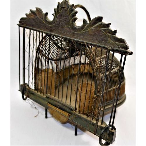 67 - A small Chinese wire and hardwood bird cage, with carrying handle, 25.5cm high x 26cm wide