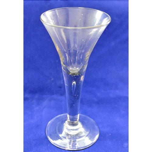 82 - A late Georgian wine glass with trumpet bowl, the stem with single tear-shaped bubble, 17cm high