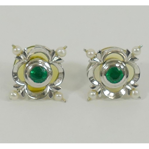 135 - A pair of 18 carat white gold emerald and seed pearl earrings by Cassandra Goad, the round mixed cut... 