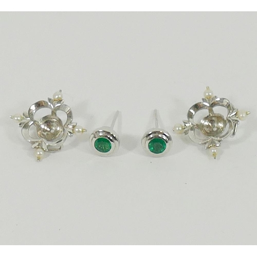 135 - A pair of 18 carat white gold emerald and seed pearl earrings by Cassandra Goad, the round mixed cut... 