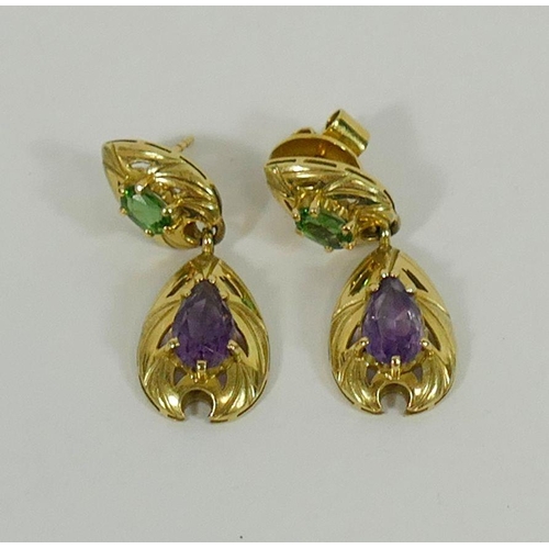 138 - A pair of yellow metal amethyst and green tourmaline drop earrings, the oval mixed cut tourmaline cl... 