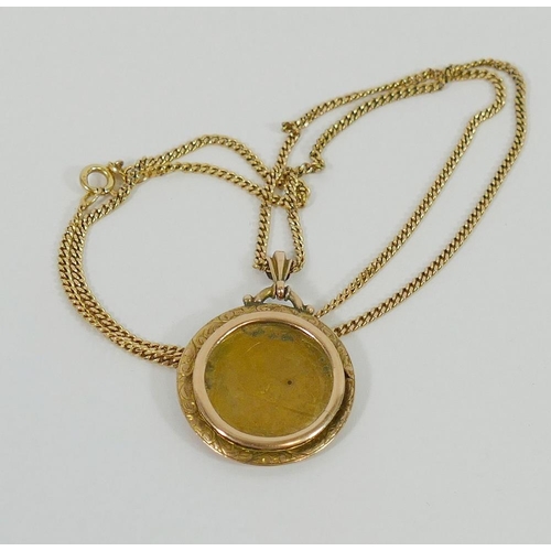 145 - A yellow metal chain stamped '375', 52cm long, 6.7g and a yellow metal circular photographic pendant... 