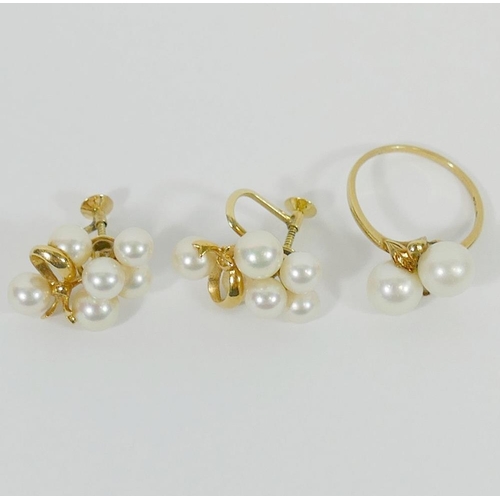 147 - A pair of Mikimoto cultured pearl yellow metal screw back earrings, stamped '14K', and a similar Mik... 