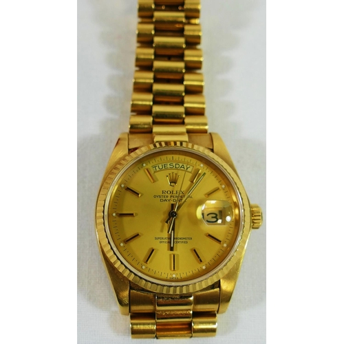 170A - A 1980's 18 carat gold Rolex Oyster perpetual day date wrist watch, the champagne dial with baton nu... 