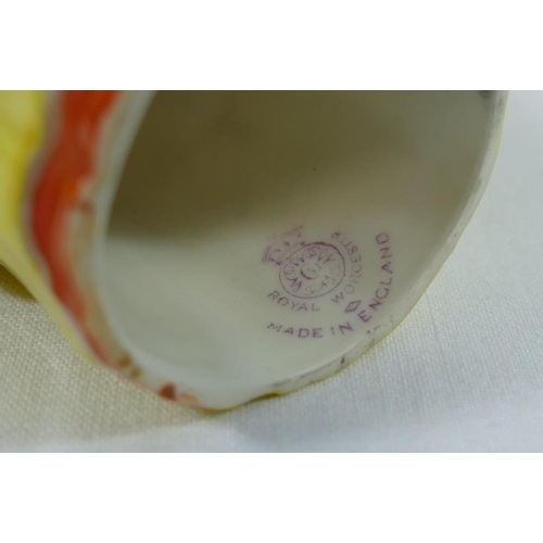 19 - A Royal Worcester porcelain candle snuffer 'Mandarin', puce mark, c.1929, 9cm high