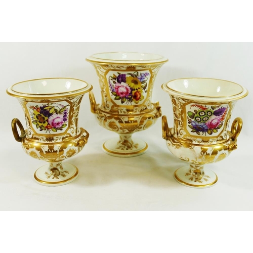 40 - A garniture of three early 19th century Derby porcelain two-handled vases, of campagna form, decorat... 