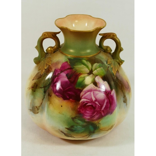 42A - A Royal Worcester two-handled vase, hand painted with roses, signed A Food, with gilt detail, with g... 