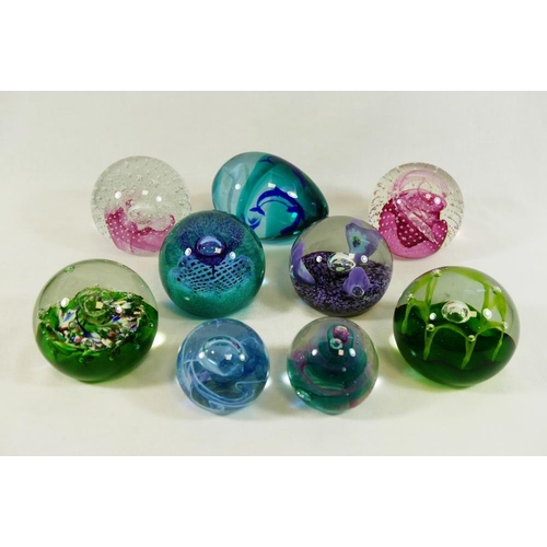 58 - A collection of 45 paperweights including a limited edition Caithness Glass paperweight by Peter Hol... 