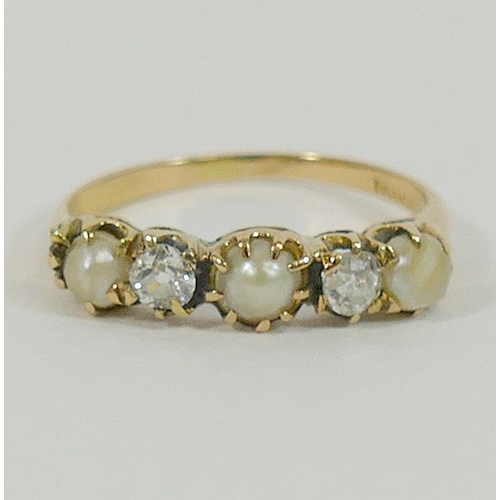 99 - A yellow metal pearl and diamond five-stone ring, the two old cut diamonds approximately 0.20 carats... 