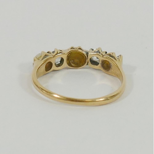 99 - A yellow metal pearl and diamond five-stone ring, the two old cut diamonds approximately 0.20 carats... 