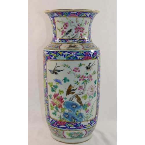 49 - A 19th century Chinese porcelain blue ground famille rose vase, decorated with panels of birds among... 