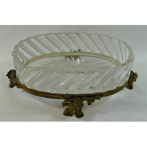 59 - A oval Baccarat ormolu mounted glass dish, raised on four floral cast feet, with maker's mark to und... 