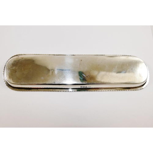 145 - An early 20th century silver pen tray, Birmingham 1912, with gadrooned rim, 24.8cm x 6.5cm, 3.68ozt,... 