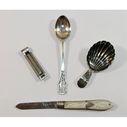 149 - A George III silver caddy spoon, with shell bowl, the handle with engraved decoration including Prin... 