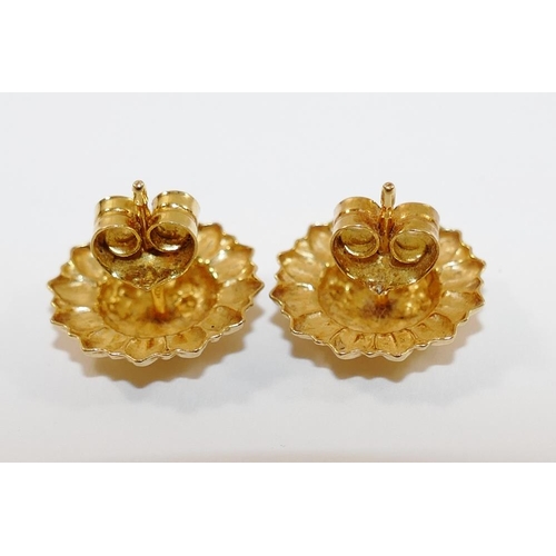 177 - A pair of Italian yellow metal stud earrings, in the shape of sunflowers, 14mm diameter, the shaft s... 