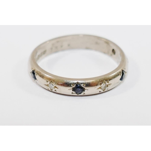 193A - An 18 carat white gold sapphire and diamond half eternity ring, Birmingham 1997, the four small roun... 