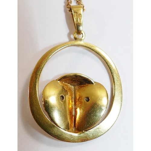 197 - A modern 18 carat gold owl head pendant with diamond set eyes, London 1996, 7.2g gross, 2.5cm diamet... 