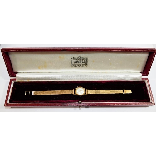 211 - An 18 carat gold cased Cyma ladies bracelet watch, the circular face with silvered dial and gilt bat... 