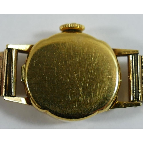 211 - An 18 carat gold cased Cyma ladies bracelet watch, the circular face with silvered dial and gilt bat... 