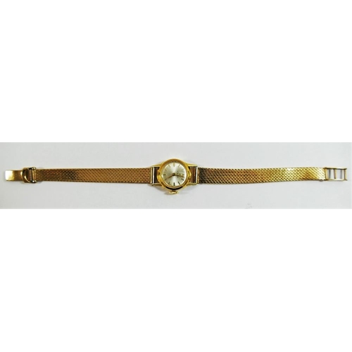 211 - An 18 carat gold cased Cyma ladies bracelet watch, the circular face with silvered dial and gilt bat... 