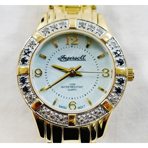 215 - An Ingersoll ladies gold plated bracelet watch with mother of pearl dial, date aperture and sapphire... 