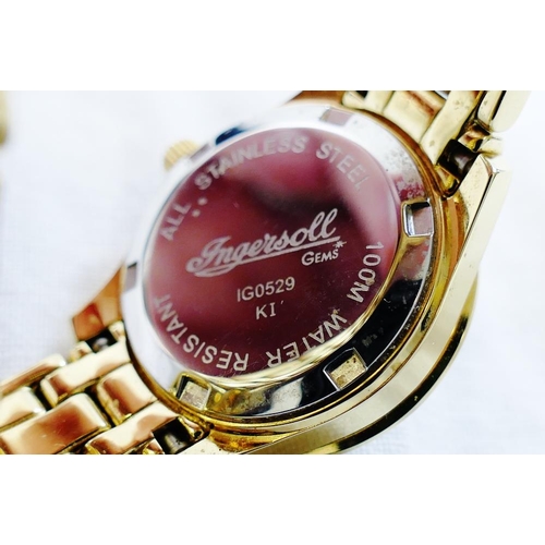 215 - An Ingersoll ladies gold plated bracelet watch with mother of pearl dial, date aperture and sapphire... 