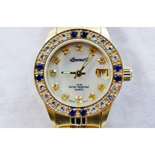 215 - An Ingersoll ladies gold plated bracelet watch with mother of pearl dial, date aperture and sapphire... 