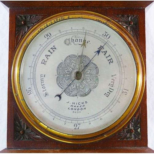 238 - A late 19th century carved walnut wall mounted aneroid barometer with thermometer, the barometer wit... 