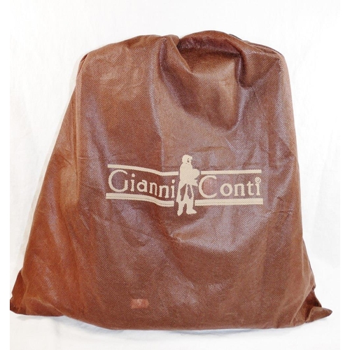 249 - A Gianni Conti black leather case, 39cm across x 32cm high (including handle), with original dust/st... 