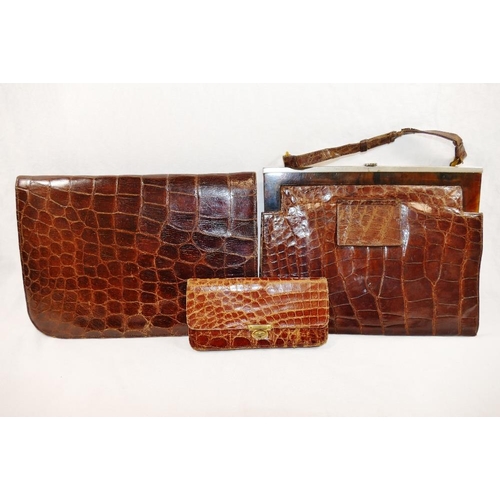 252 - A 1930s crocodile skin clutch bag, 24cm wide, a crocodile skin handbag, with adjustable strap and fa... 