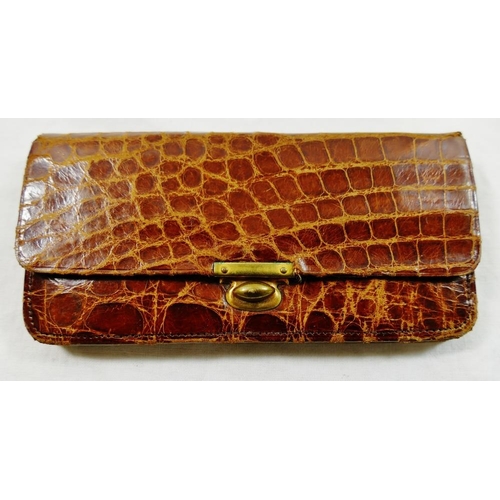 252 - A 1930s crocodile skin clutch bag, 24cm wide, a crocodile skin handbag, with adjustable strap and fa... 