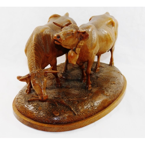 309 - A Swiss Brienz carving of two horned cows, one with a bell, by the  Huggler brothers and stamped 'Hu... 