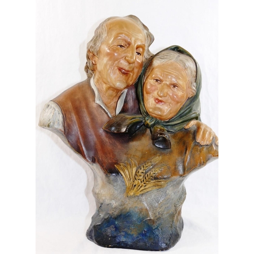 310 - Ezio Ceccarelli (1865-1927), a painted pottery group of an elderly peasant couple laughing, with imp... 