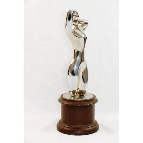 311 - A chrome plated figure of a nude, in a similar pose to Man Ray's 'Herma', unsigned, 20cm high, on pa... 