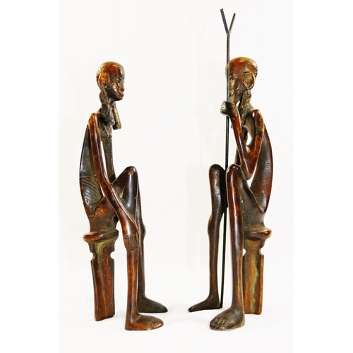 312 - A pair of 20th century bronze Lobi style figures of a West African tribal couple, both seated on sto... 