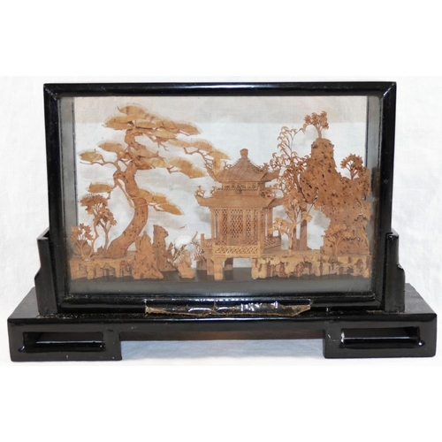 32 - A 20th century Chinese carved cork landscape diorama, depicting trees, a pagoda and cranes, housed w... 