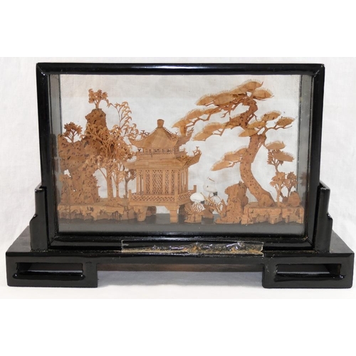 32 - A 20th century Chinese carved cork landscape diorama, depicting trees, a pagoda and cranes, housed w... 