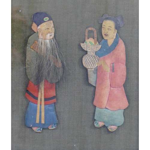 37 - An early 20th century Chinese fabric covered panel mounted in relief with a pair of painted fabric, ... 