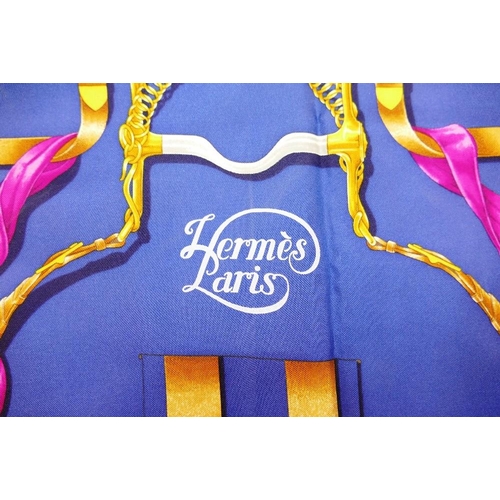 42 - A Hermes blue ground 'Grand Manège' silk scarf, by Henri d'Origny, 89cm x 89cm, with bag