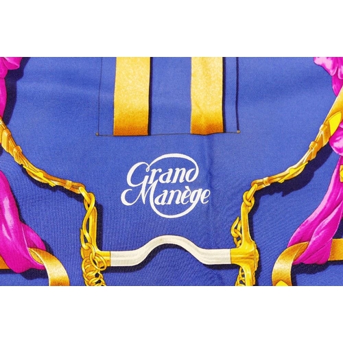 42 - A Hermes blue ground 'Grand Manège' silk scarf, by Henri d'Origny, 89cm x 89cm, with bag