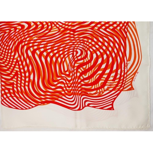 44 - A Hermes 'Onde de Chic' cream ground silk scarf, designed by Dimitri Rybaltchenko, 89cm x 89cm, with... 