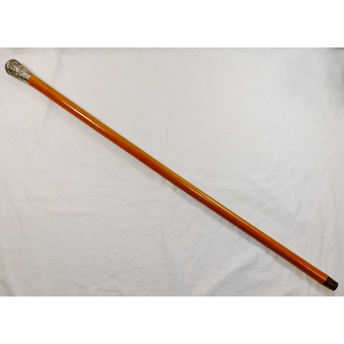 52 - A Chinese malacca cane with silver coloured metal top, decorated with embossed foliate panels and ch... 