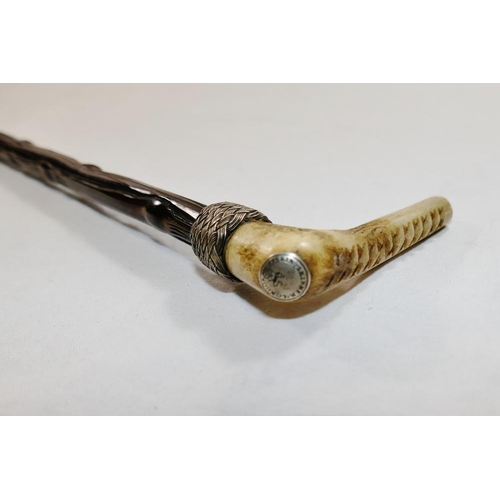 54 - An antler handled baleen riding crop, with woven silver coloured metal wire mounts, the handle with ... 