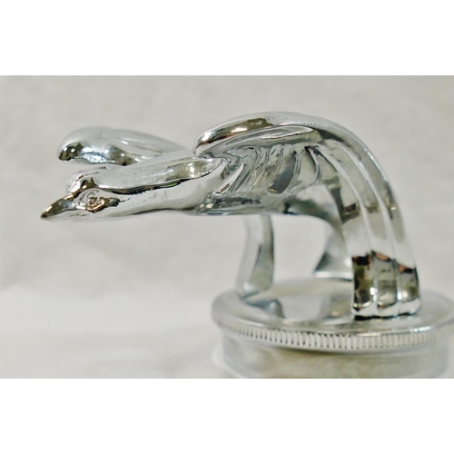 64 - A chrome plated Chevrolet 'Chevy' eagle car mascot, 14.5cm long, base 7.5cm diameter, and a novelty ... 