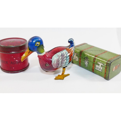 65 - A small tin plate clockwork duck, stamped  'Made in US zone Germany', 7cm long, with key, a small no... 