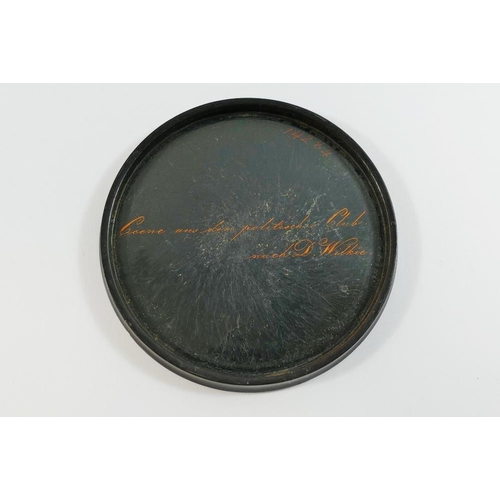 72 - A late 18th century German papier mache circular snuff box, the lid decorated with a scene after Sir... 